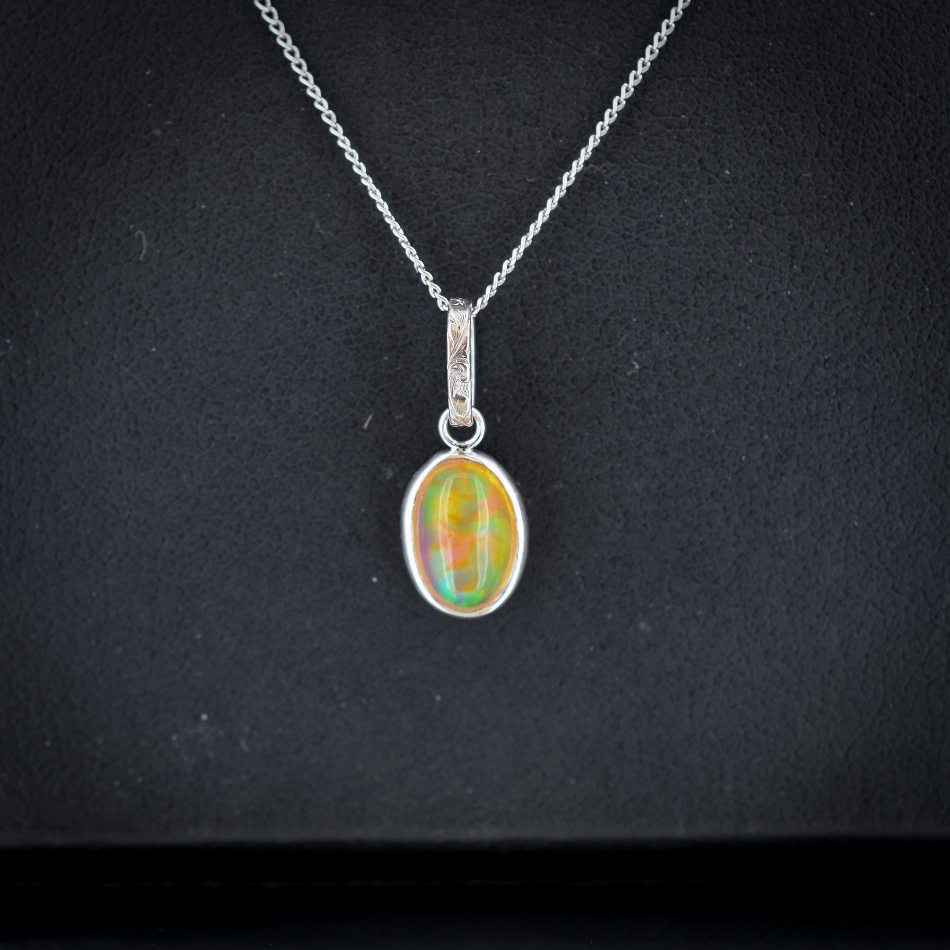 0.96ct Natural Fire Opal Oval Platinum Charm Pendant