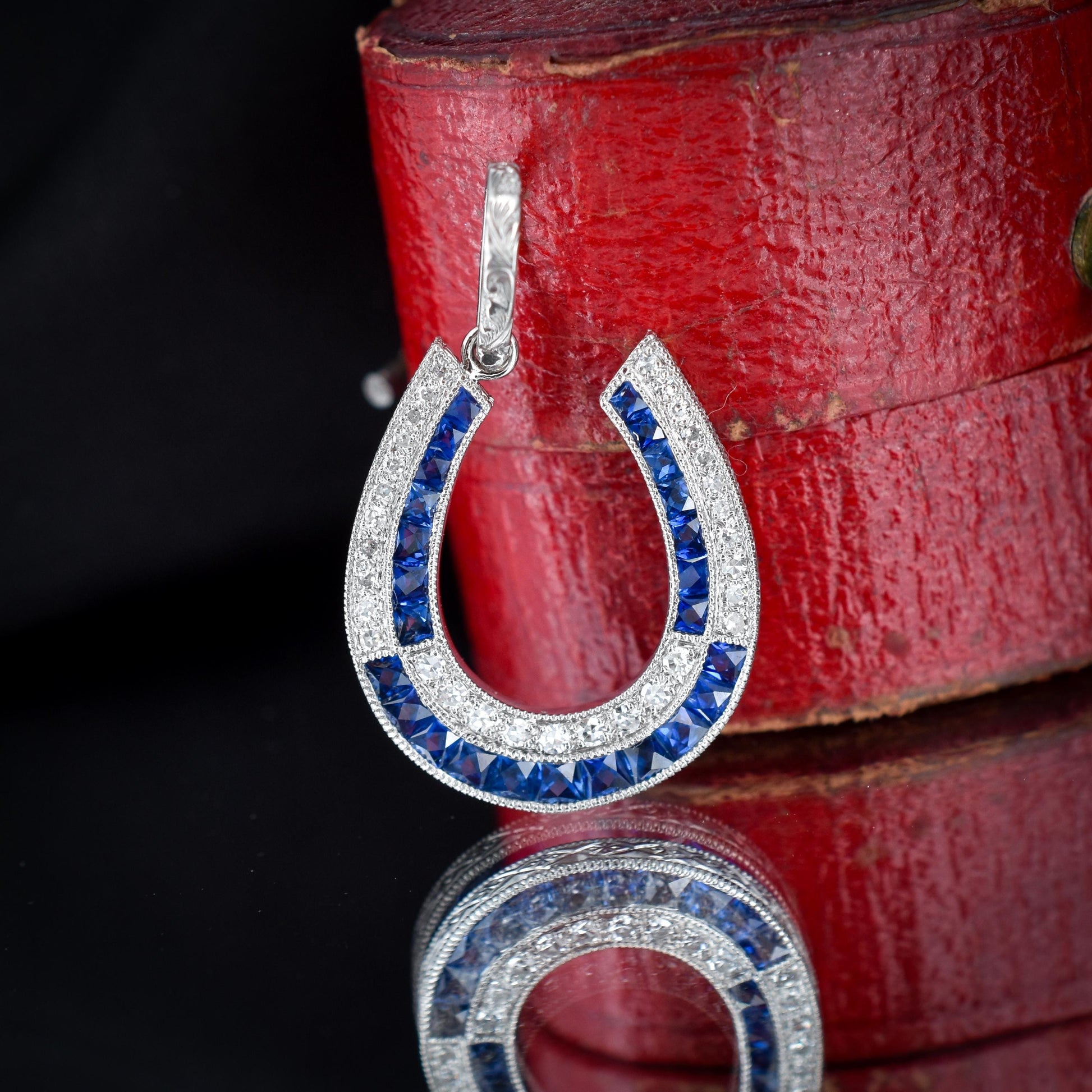 Blue Sapphire and Diamond Double Row Horseshoe Platinum Charm Pendant