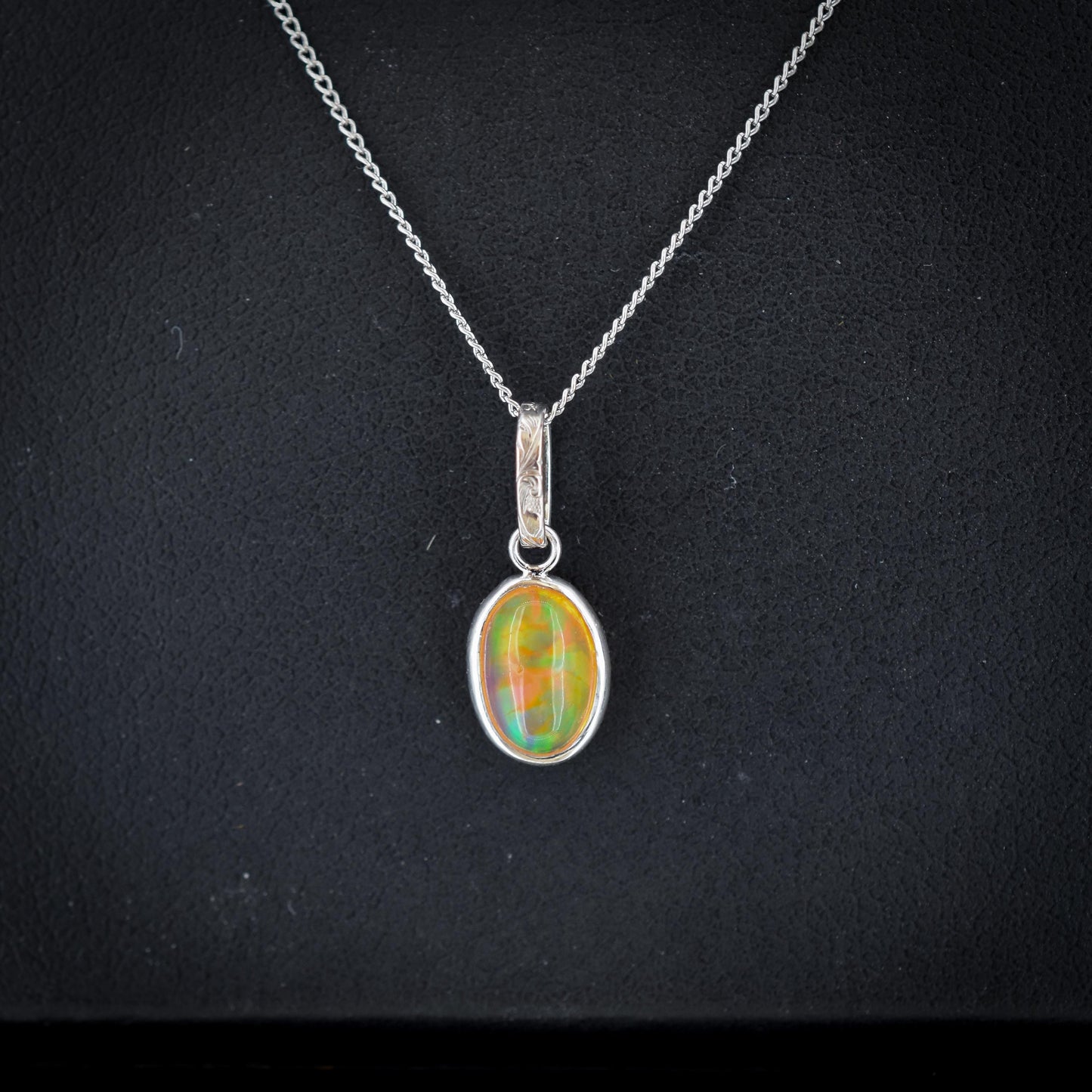 0.96ct Natural Fire Opal Oval Platinum Charm Pendant