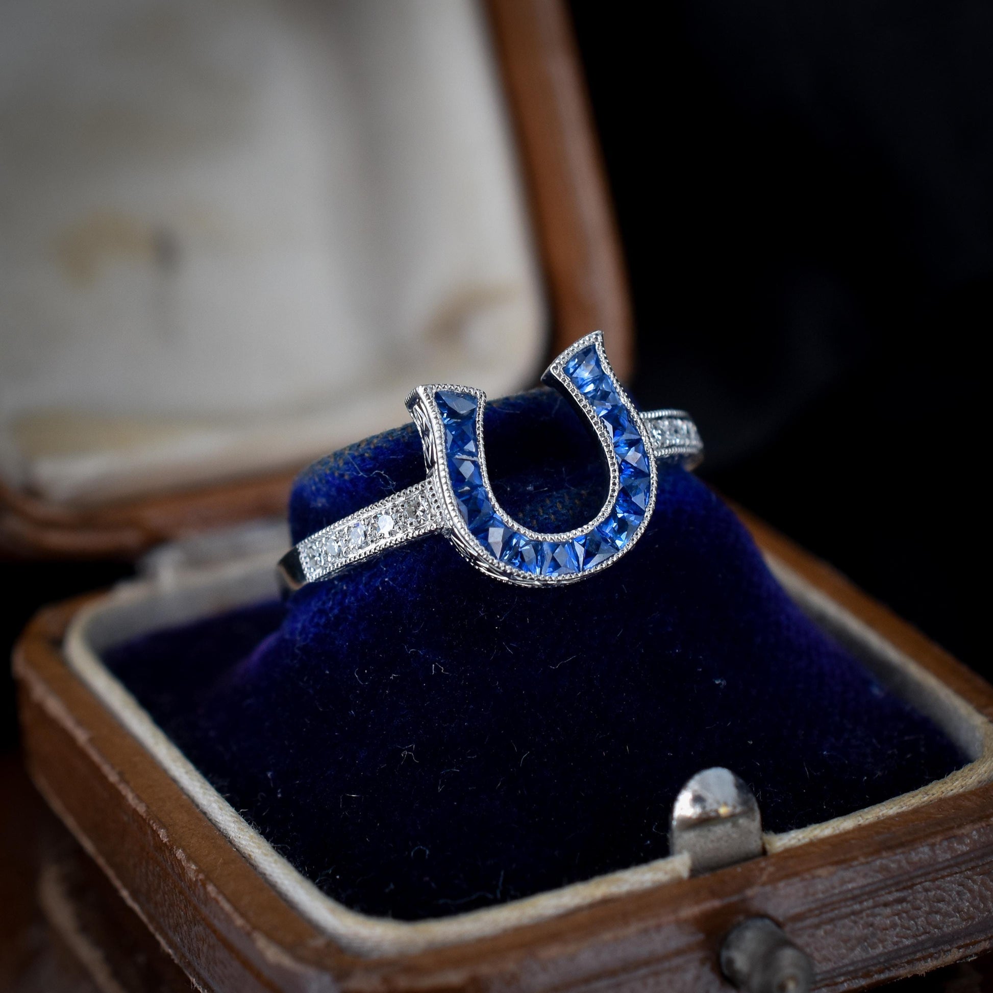 French Cut 0.55ct Blue Sapphire and Diamond Horseshoe Platinum Ring