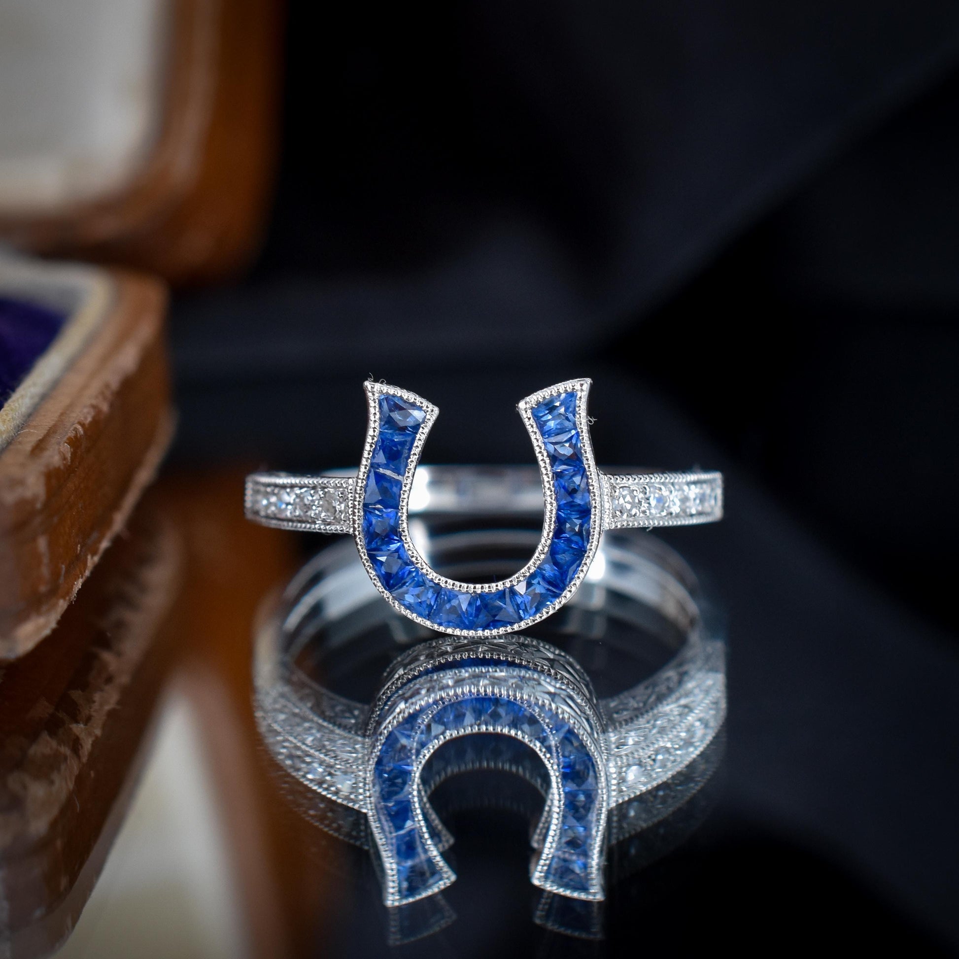 French Cut 0.55ct Blue Sapphire and Diamond Horseshoe Platinum Ring