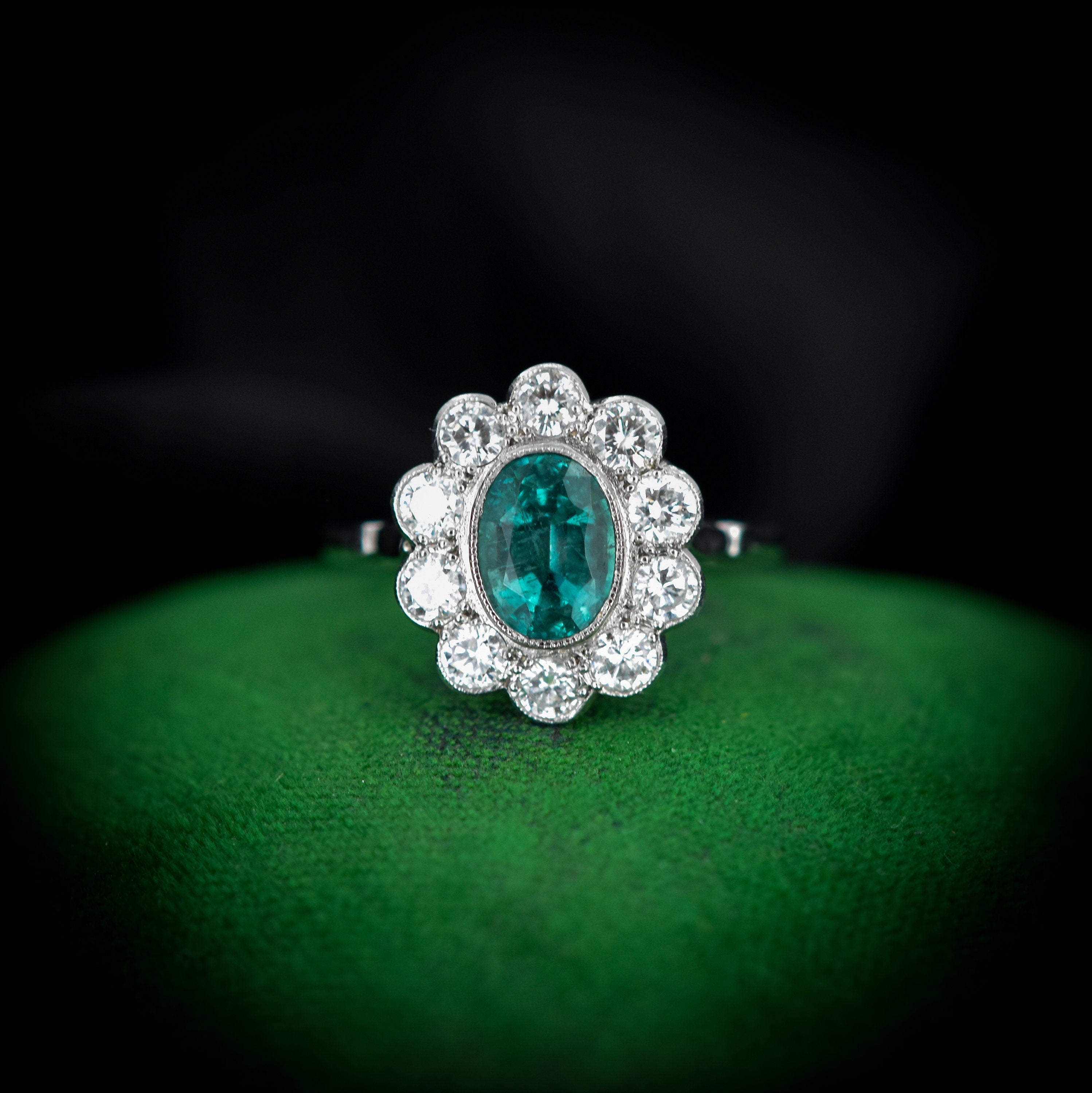 Diamond with emerald on sale halo