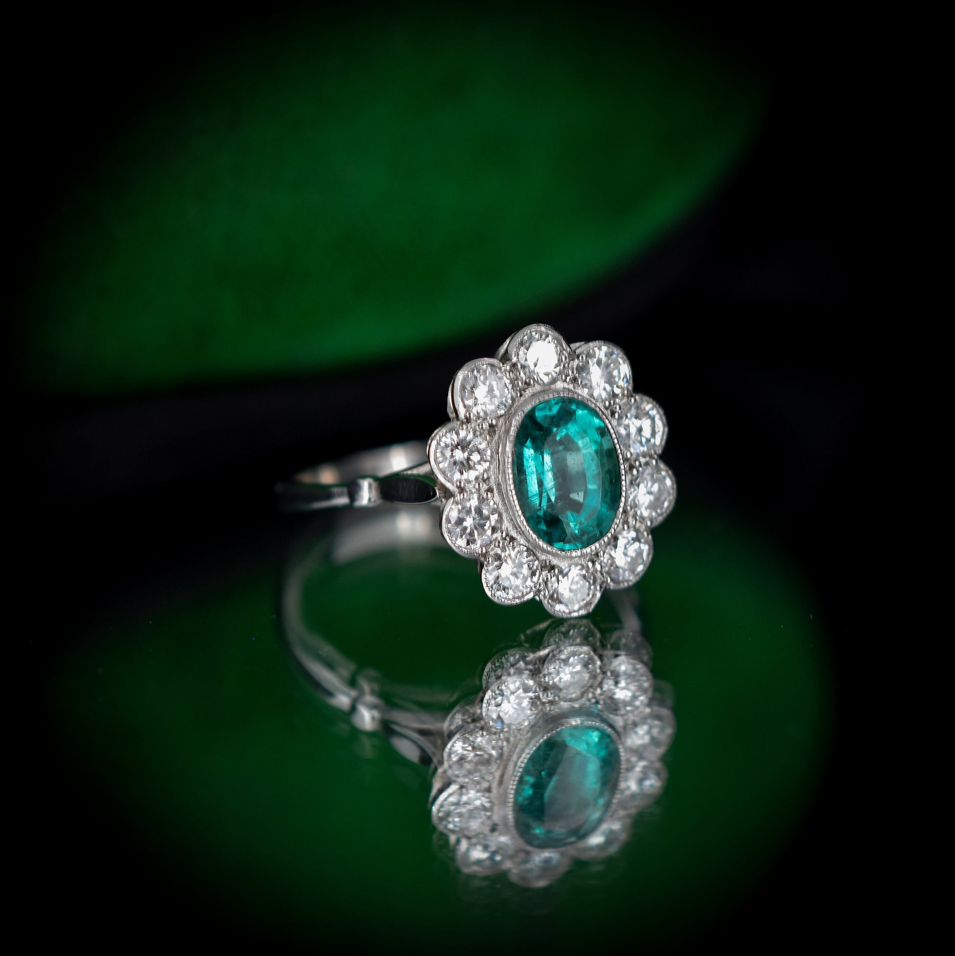 Emerald and Diamond Oval Cluster Halo Platinum Ring | Antique Style